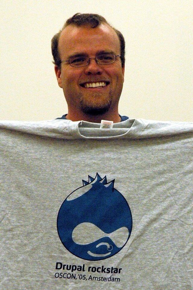 photo © Dries Buytaert, Rasmus Lerdorf, founder of PHP with a DrupalCon Amsterdam 2005 t-shirt